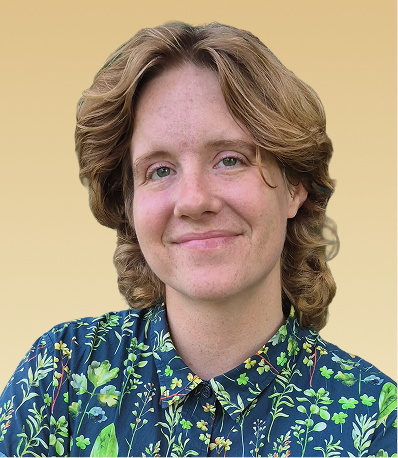 Therapist with shoulder-length wavy hair wearing a navy floral patterned shirt against a tan background