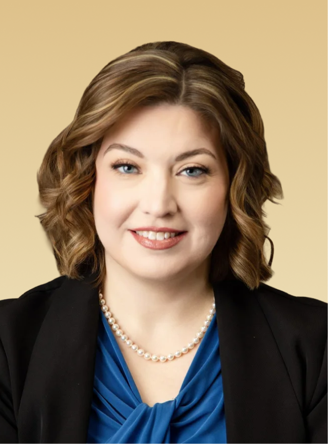 Michelle Kachman, MD, professional headshot wearing black blazer and pearl necklace