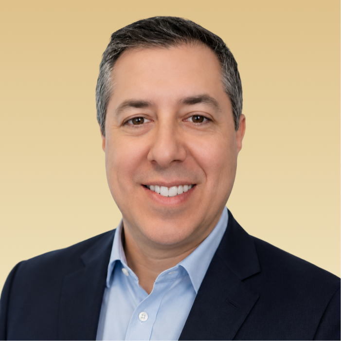 Philip Waitzman, team member, smiling at camera in professional headshot