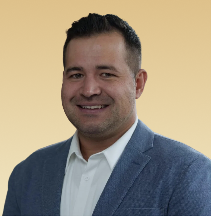 Tyler Brodhead, MA, LPC, professional headshot wearing a blue blazer and white shirt
