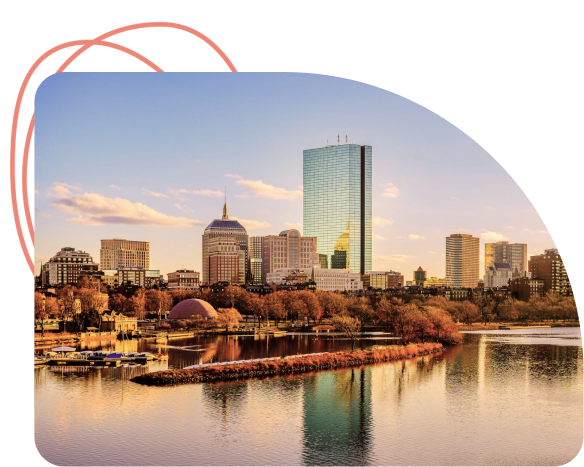 Boston skyline with tall buildings reflecting in Charles River at sunset