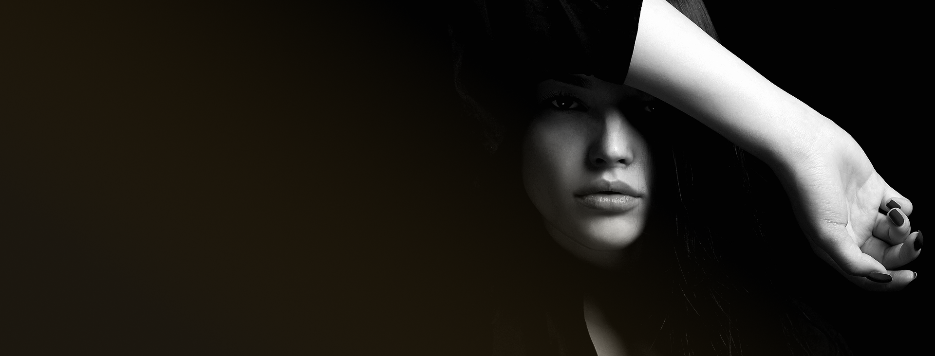 Woman's face partially shadowed with arm raised across torso