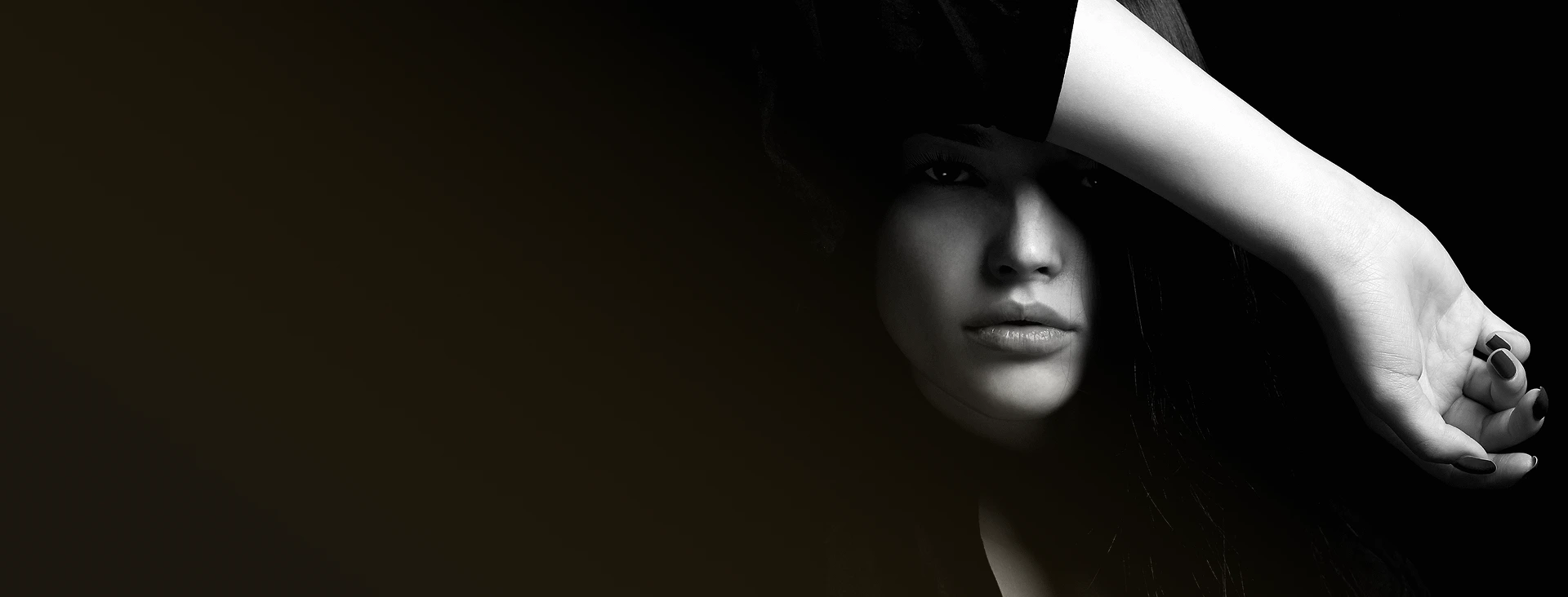 Woman's face partially shadowed with arm raised across torso