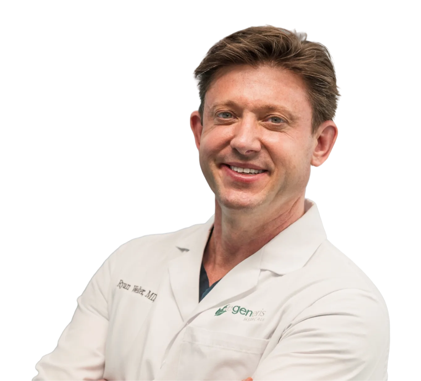 Male physician in white coat with Genesis logo smiling at camera