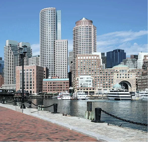 Boston waterfront skyline with downtown buildings and harbor