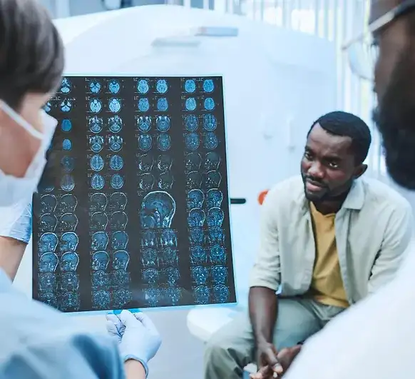 Psychiatric nurse practitioner reviewing brain scan images with a patient during mental health consultation