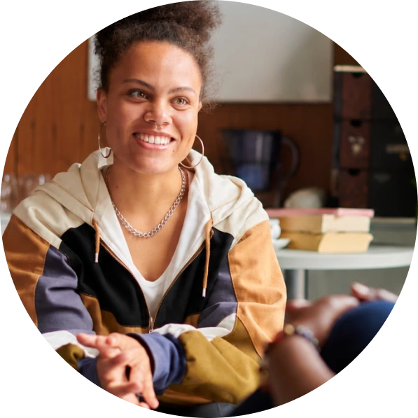 Psychiatric nurse practitioner smiling during a patient consultation at Reliant Family Psychiatry