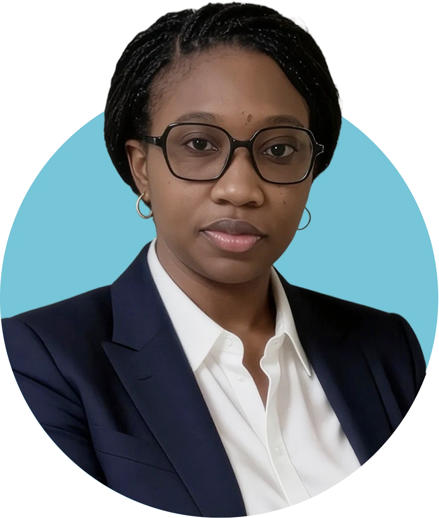 Lisandra Lysaith, wearing glasses and a dark blazer with white shirt, professional headshot