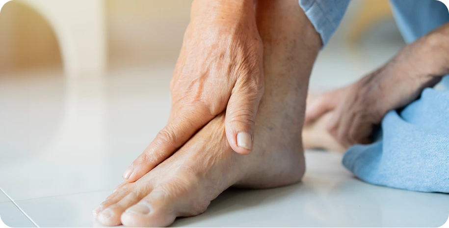 Hands examining a patient's foot and ankle for signs of neuropathy or nerve damage