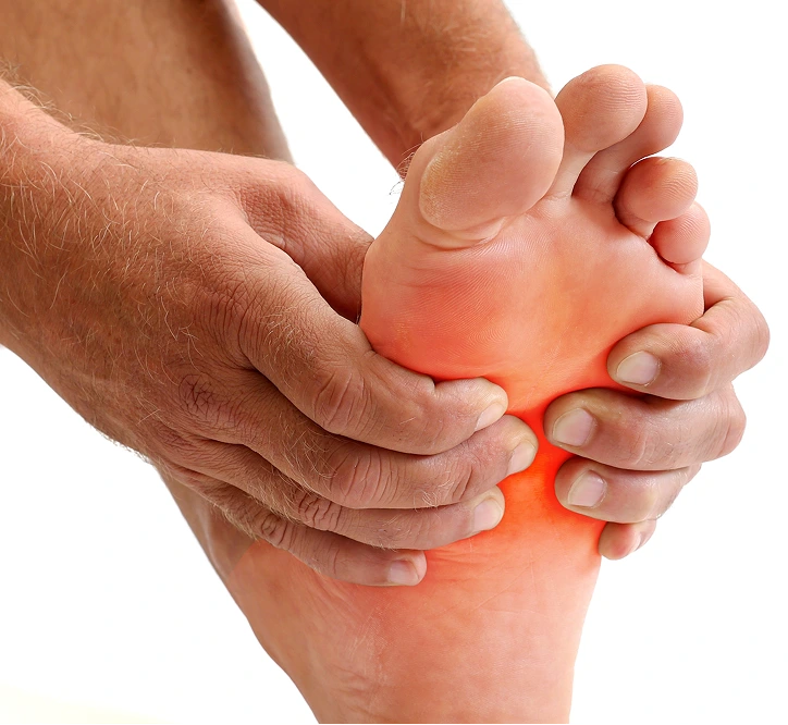 Hands holding foot with red highlighted area indicating inflammation or injury