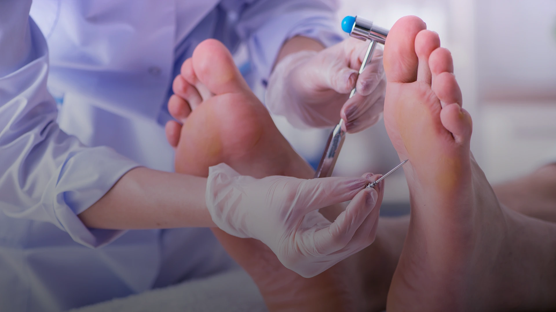 Podiatrist in gloves using handheld device to treat patient's foot