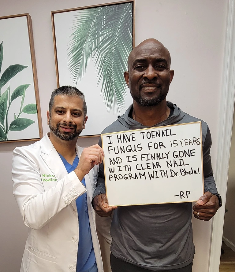 Podiatrist with patient holding testimonial about 15-year toenail fungus resolved with Clear Nail Program