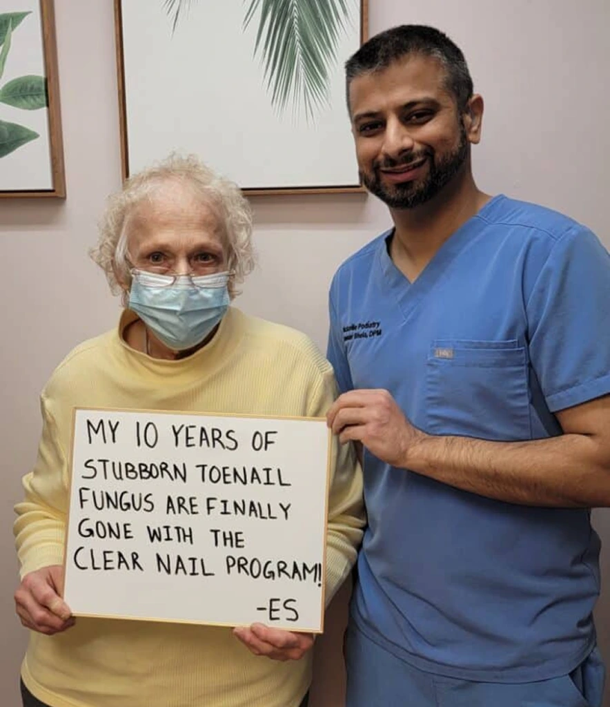 Patient and podiatrist holding sign reading 'My 10 years of stubborn toenail fungus are finally gone with the Clear Nail Program'