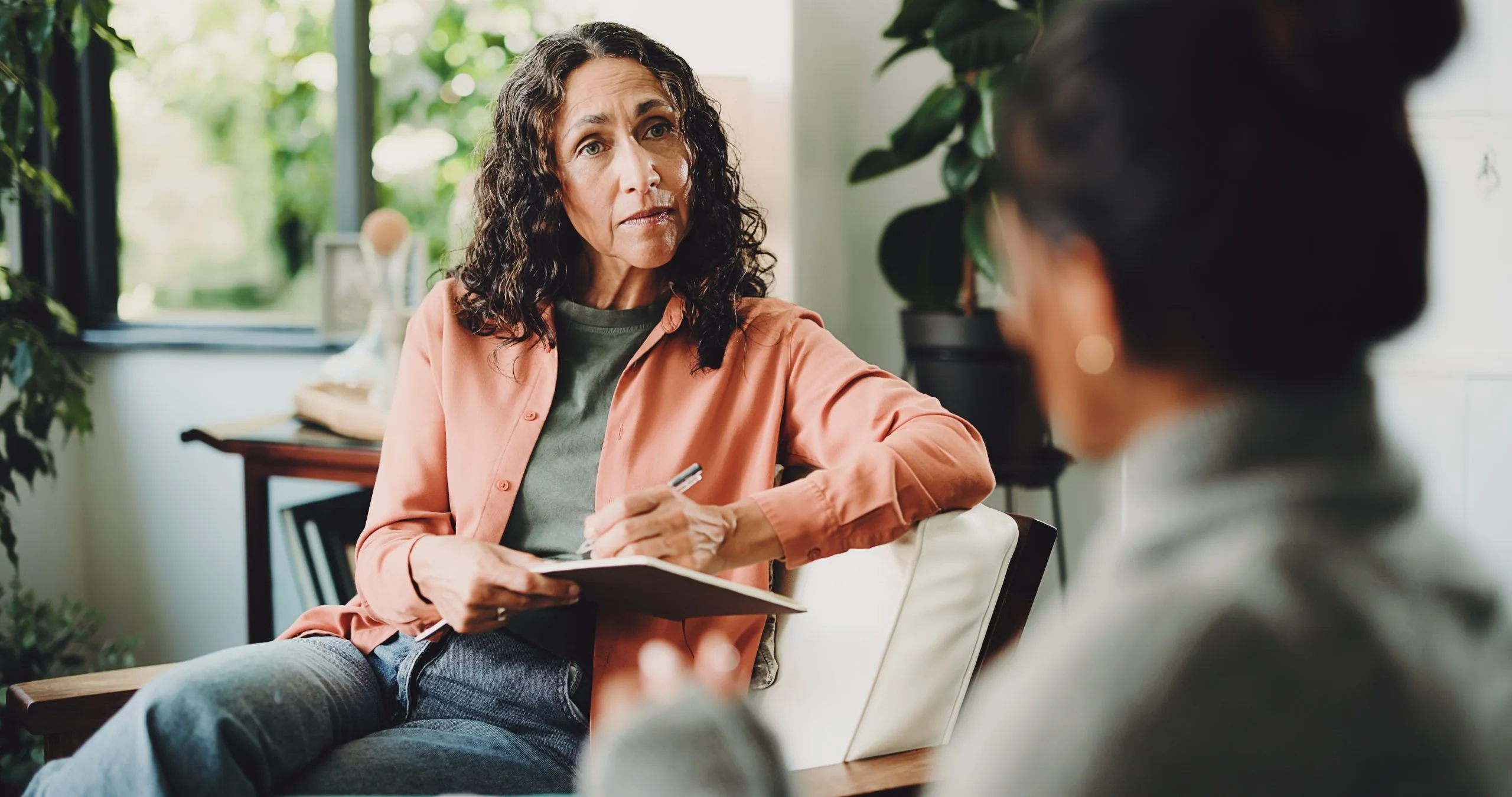 Therapist and patient talking in an office appointment in Fontana, CA