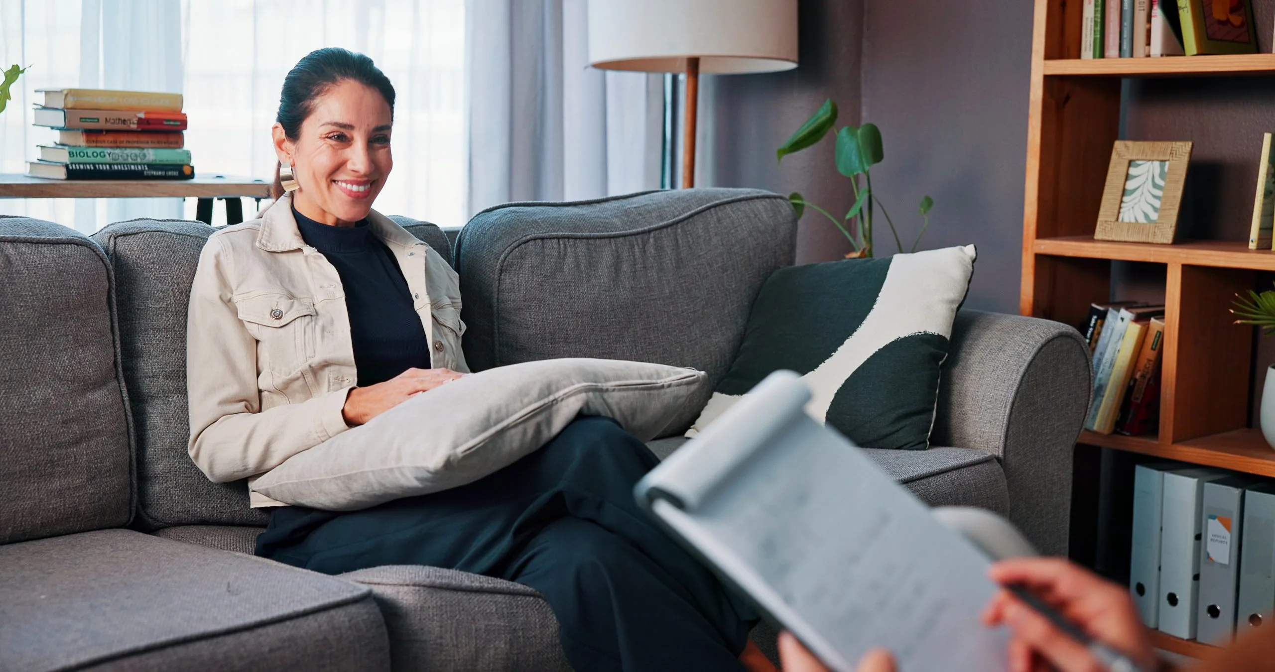 Happy woman patient talking with her therapist during counseling in Glendale, CA