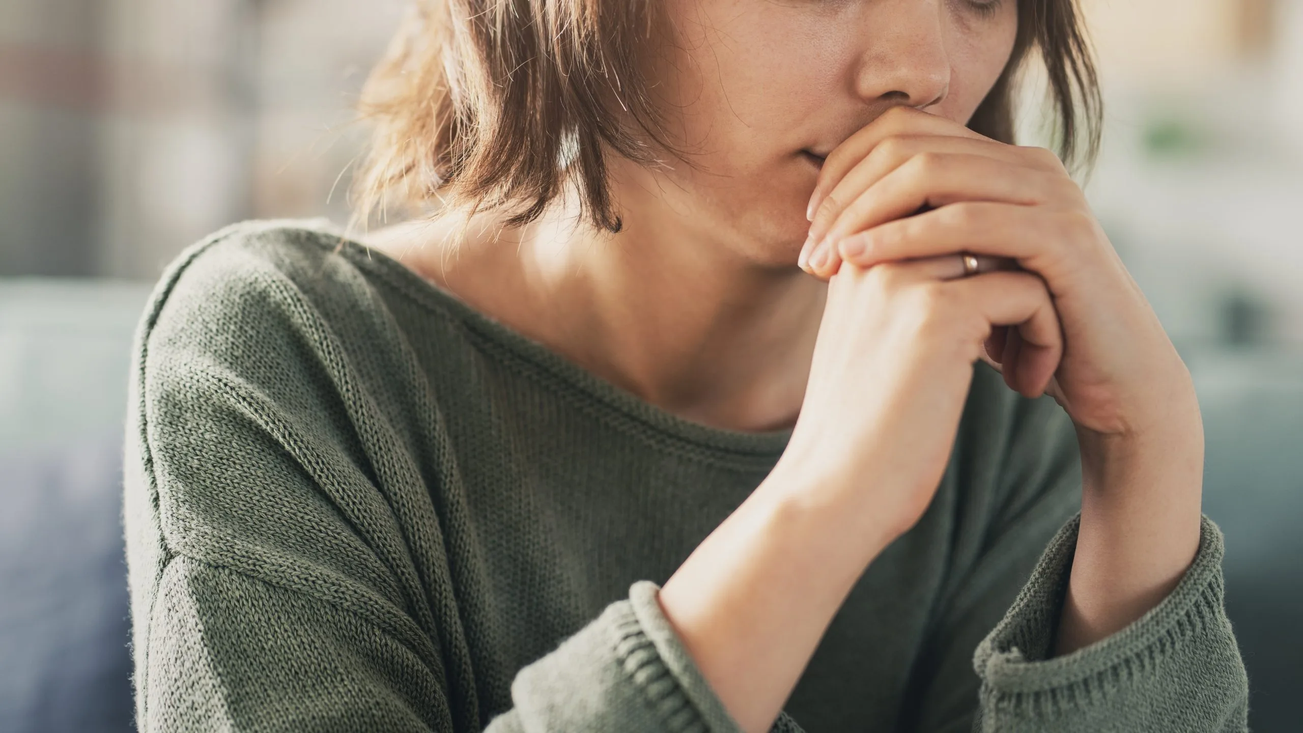 Young woman coping with loss and psychological trauma seeking psychiatric support