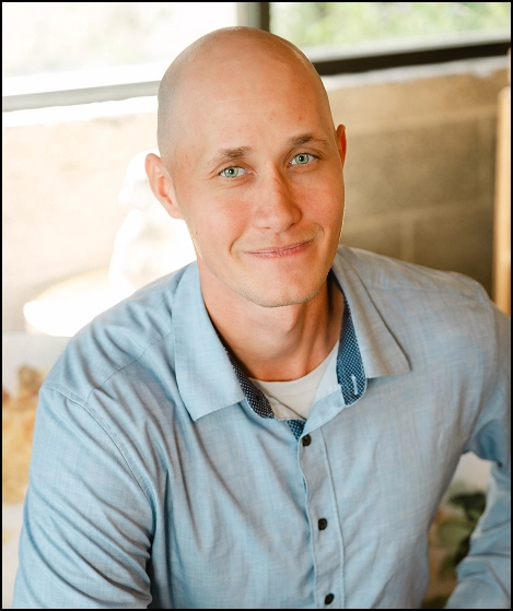 Avery Booth, man wearing light blue button-up shirt