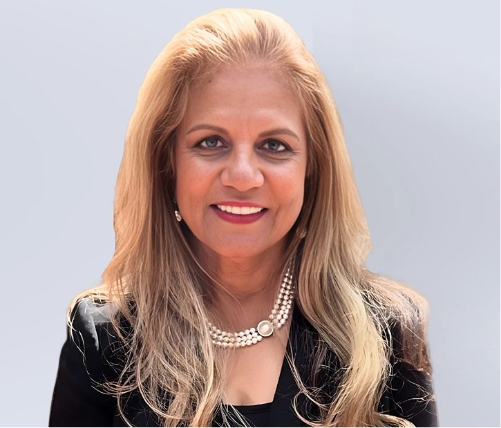 Patricia X. Shorr smiling in professional headshot wearing pearl necklace and black blazer