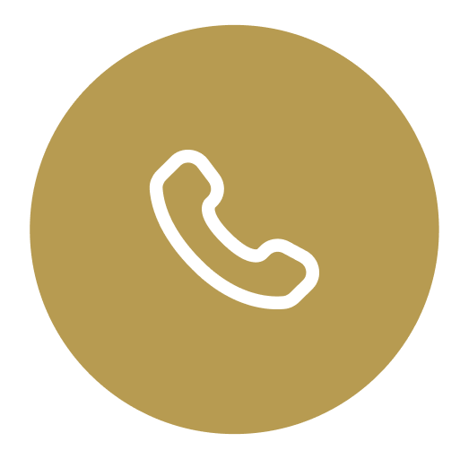 White telephone icon on gold circular background