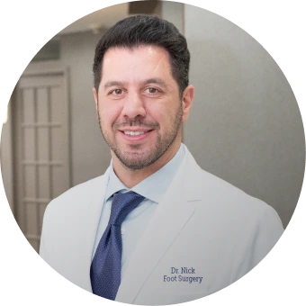 Dr Nick, foot surgery specialist, in light blue shirt and dark blue tie