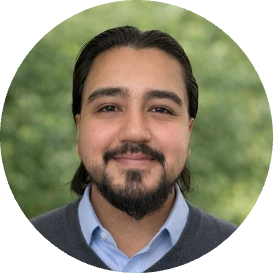 Albert Hernandez, headshot with green background