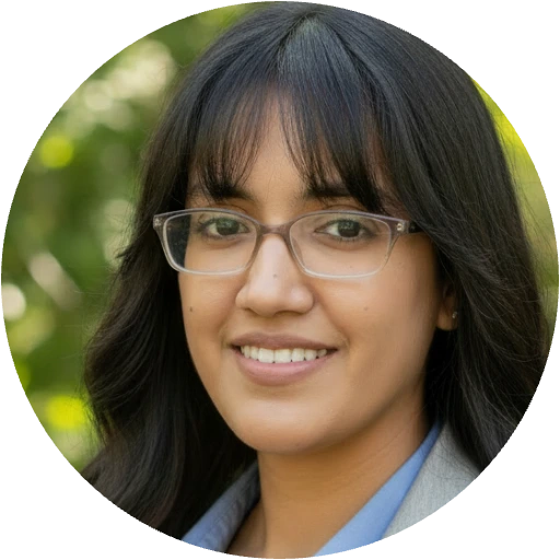 Michelle Ortiz, woman wearing glasses smiling outdoors with green blurred background