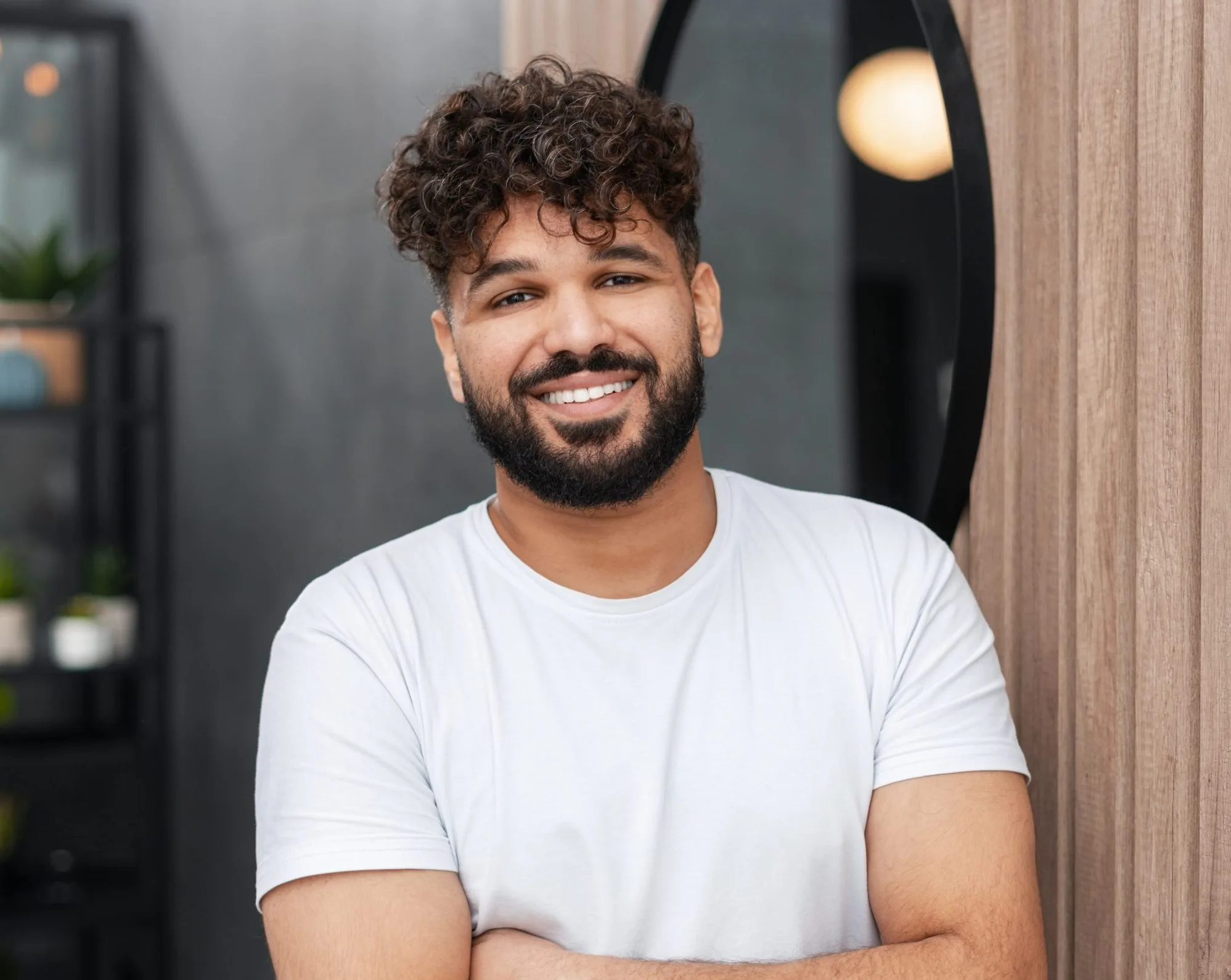 Man smiling in a modern clinical waiting room setting