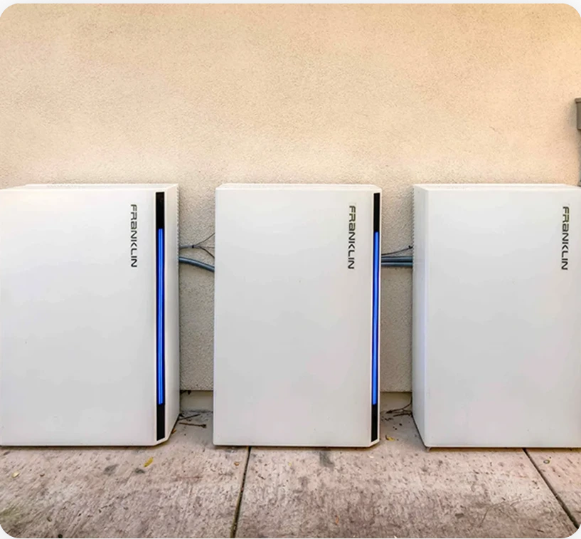 Three Franklin home battery units installed on outdoor concrete floor