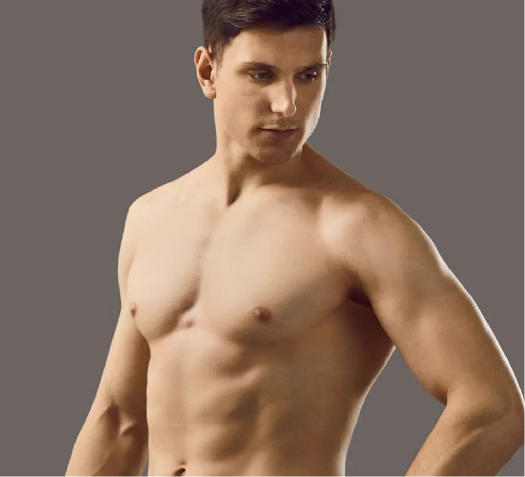 Shirtless man facing forward against gray background