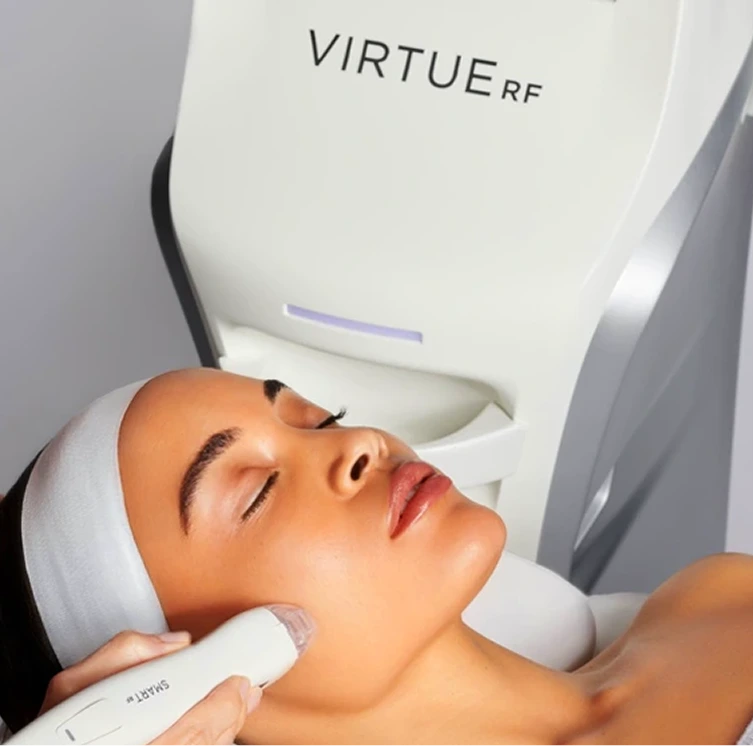 Virtue RF device performing microneedling treatment on patient's cheek