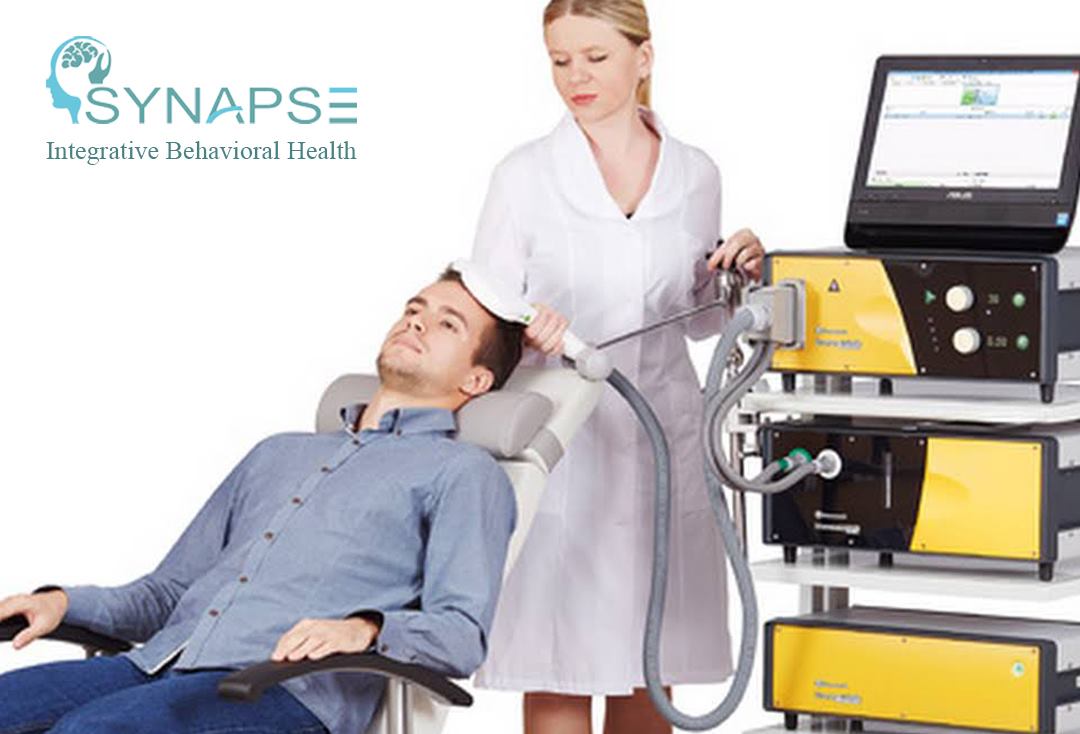 Synapse Integrative Behavioral Health logo with clinician operating TMS therapy device on seated patient