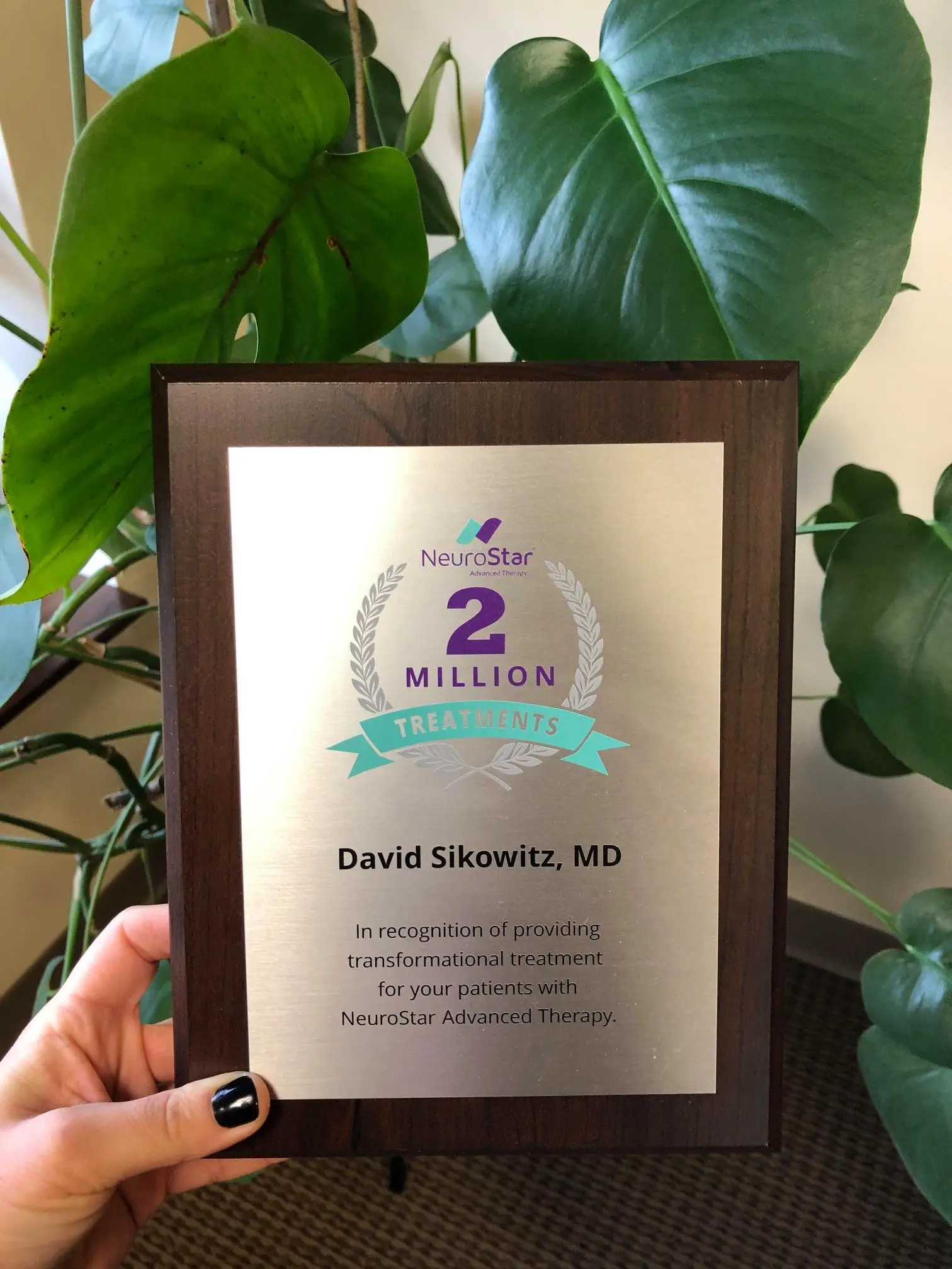NeuroStar 2 Million Treatments award plaque recognizing David Sikowitz, MD for providing transformational treatment with NeuroStar Advanced Therapy