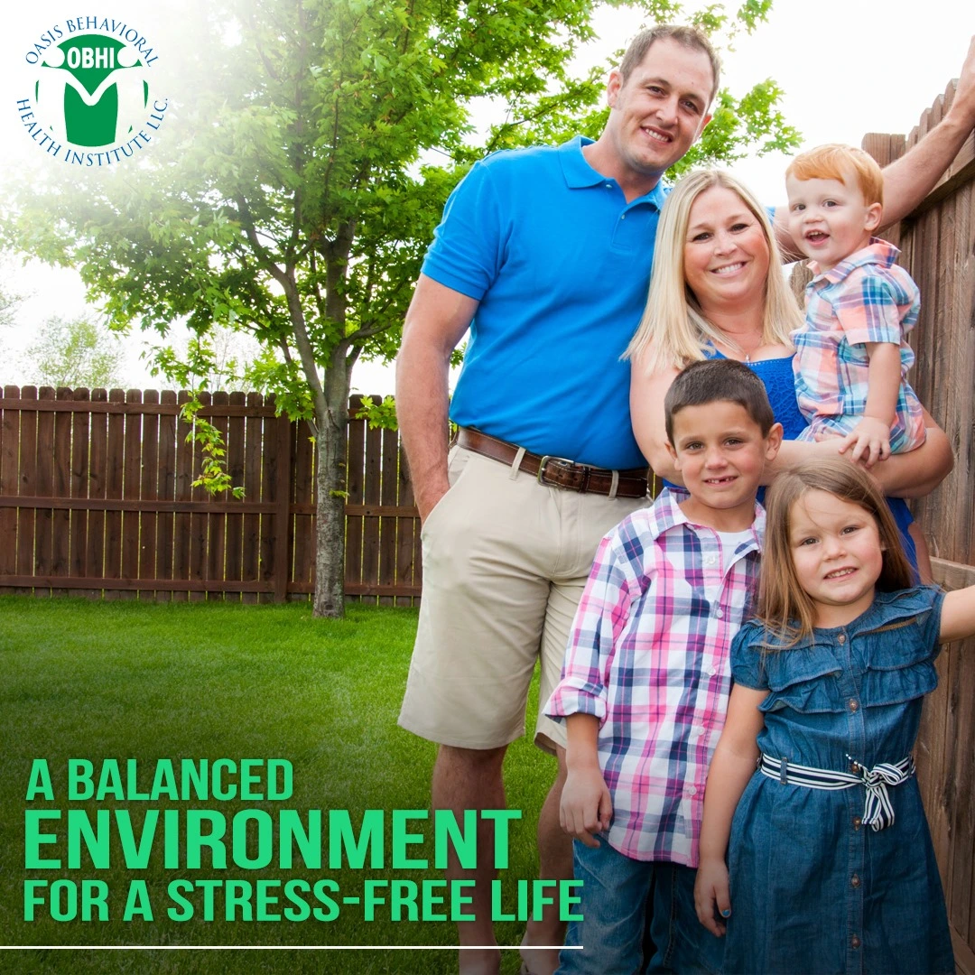 Family of five smiling outdoors in backyard with text "A Balanced Environment for a Stress-Free Life"