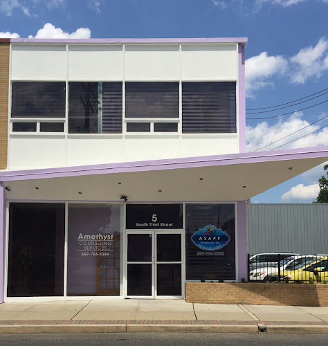 Amethyst Growth & Counseling Services storefront with purple trim and signage