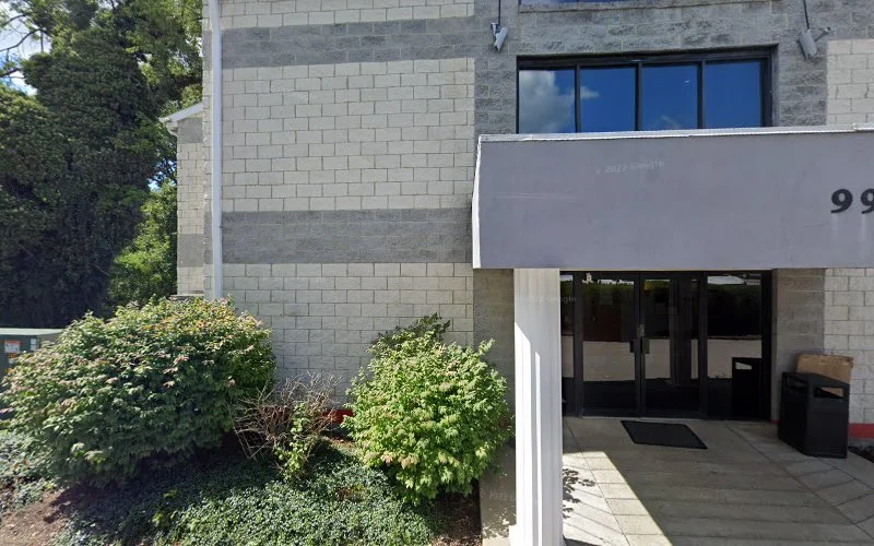 Aurora Transformations TMS Therapy & Psychiatry building entrance with ivy and awning