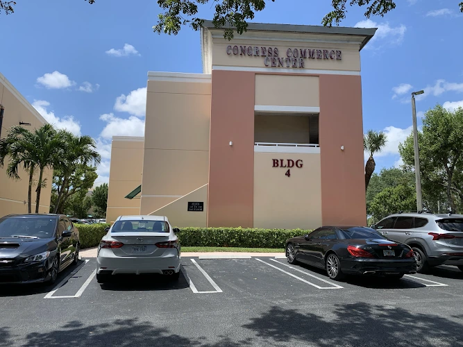 Concourse Commerce Center Building 4 exterior with red and tan facade in parking lot
