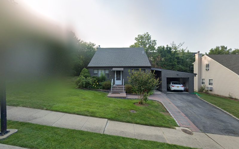 Single-story residential house with attached garage and driveway