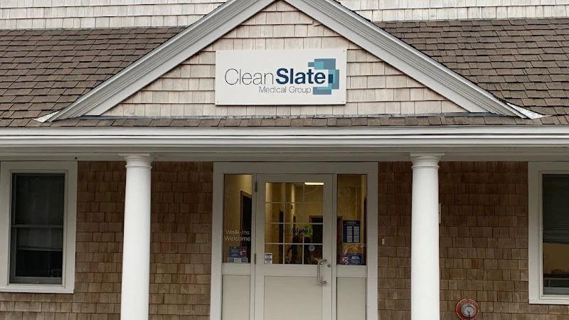 Clean Slate Medical Group building entrance with sign on shingled facade