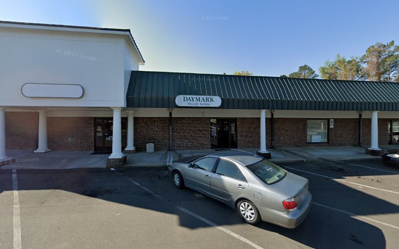 Daymark Recovery Services Vance Center brick building with parked car in front