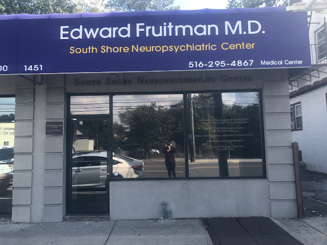 Edward Fruitman M.D. South Shore Neuropsychiatric Center storefront with blue signage and phone number