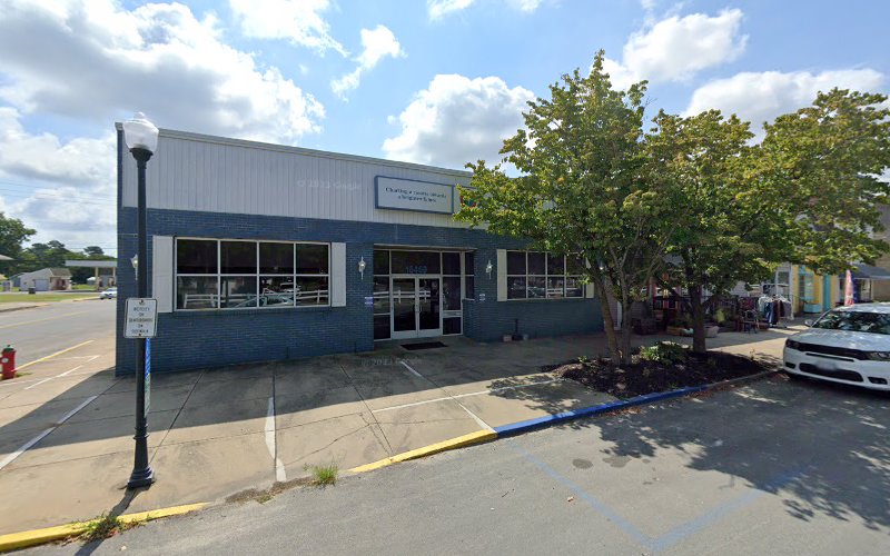 Eastern Shore Community Services Board single-story blue and white building exterior with parking lot and large tree