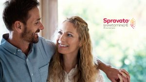 Couple smiling together with Spravato (esketamine) 28 mg nasal spray product logo