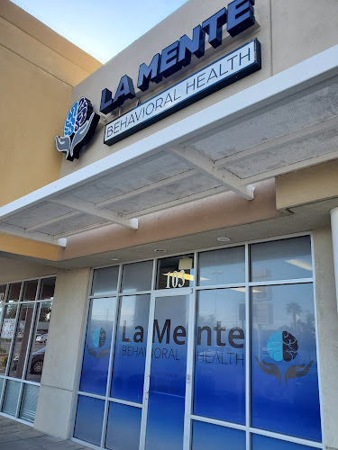 La Mente Behavioral Health storefront with blue signage and glass entrance doors