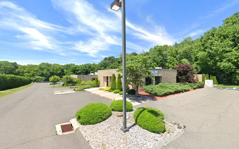 Massachusetts Society for the Prevention of Cruelty to Children (MSPCC) Holyoke building exterior with stone facade and landscaped grounds