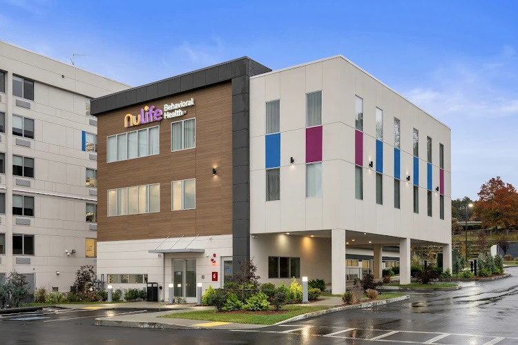 NuLife Behavioral Health modern two-story building with wood and white exterior paneling