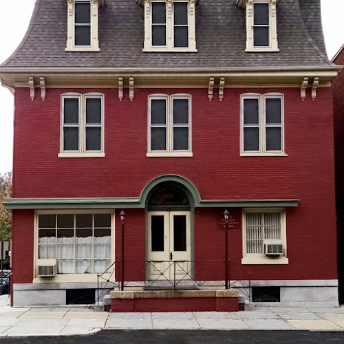 Pennsylvania Counseling Services Children's Services red brick building with dormer windows and arched entrance