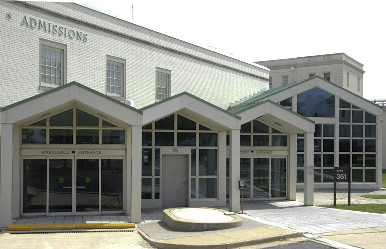 Perry Point VA Medical Center admissions building exterior with entrance and large windows