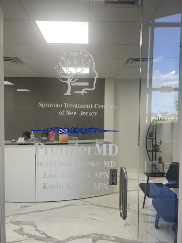 Treatment center reception area with brain graphic and Spravato signage