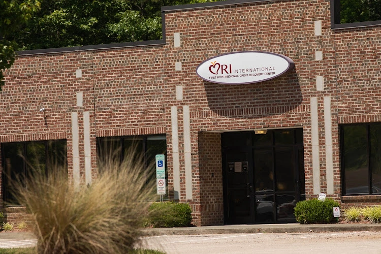 CRI International brick building exterior with sign and entrance