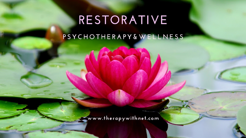 Bright magenta lotus flower floating on lily pads with Restorative Psychotherapy & Wellness text overlay